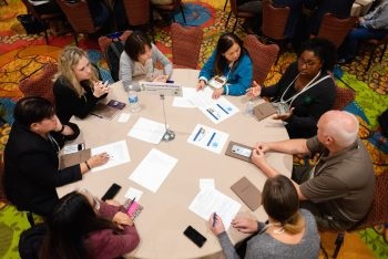 group-discussion-aerial-view-scaled